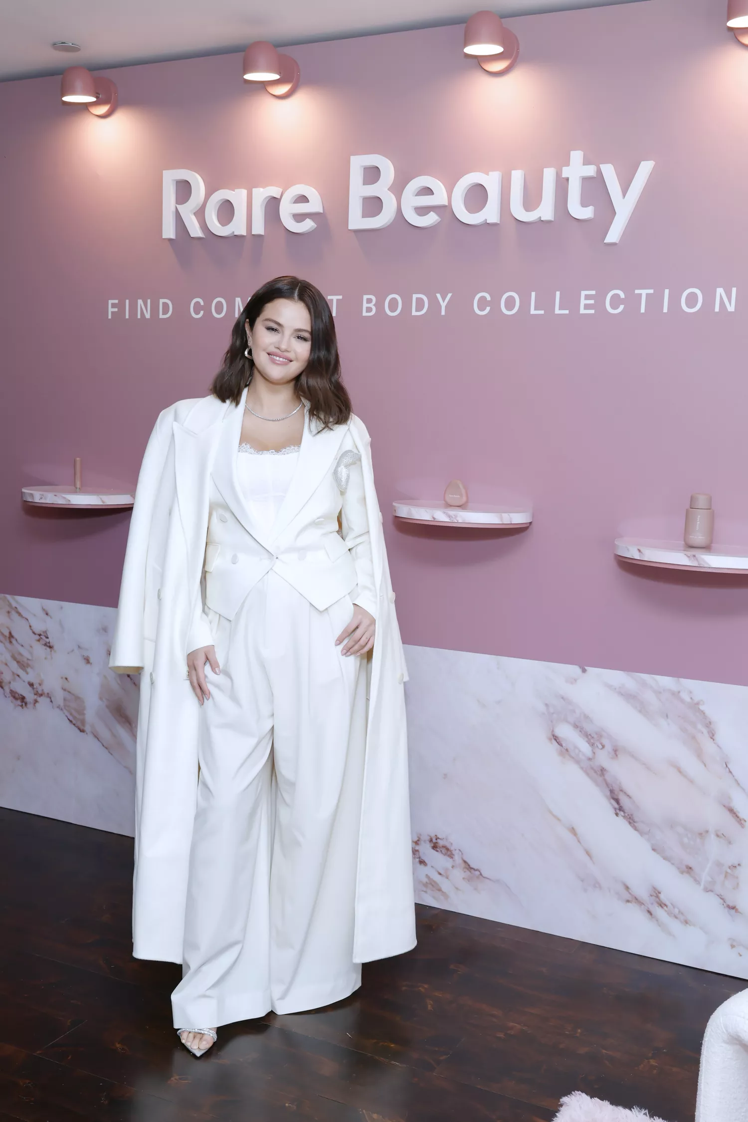 Selena Gomez Nails the Winter Whites Trend with a Lace Corset and Monochromatic Pantsuit Selena Gomez Nails the Winter Whites Trend with a Lace Corset and Monochromatic Pantsuit